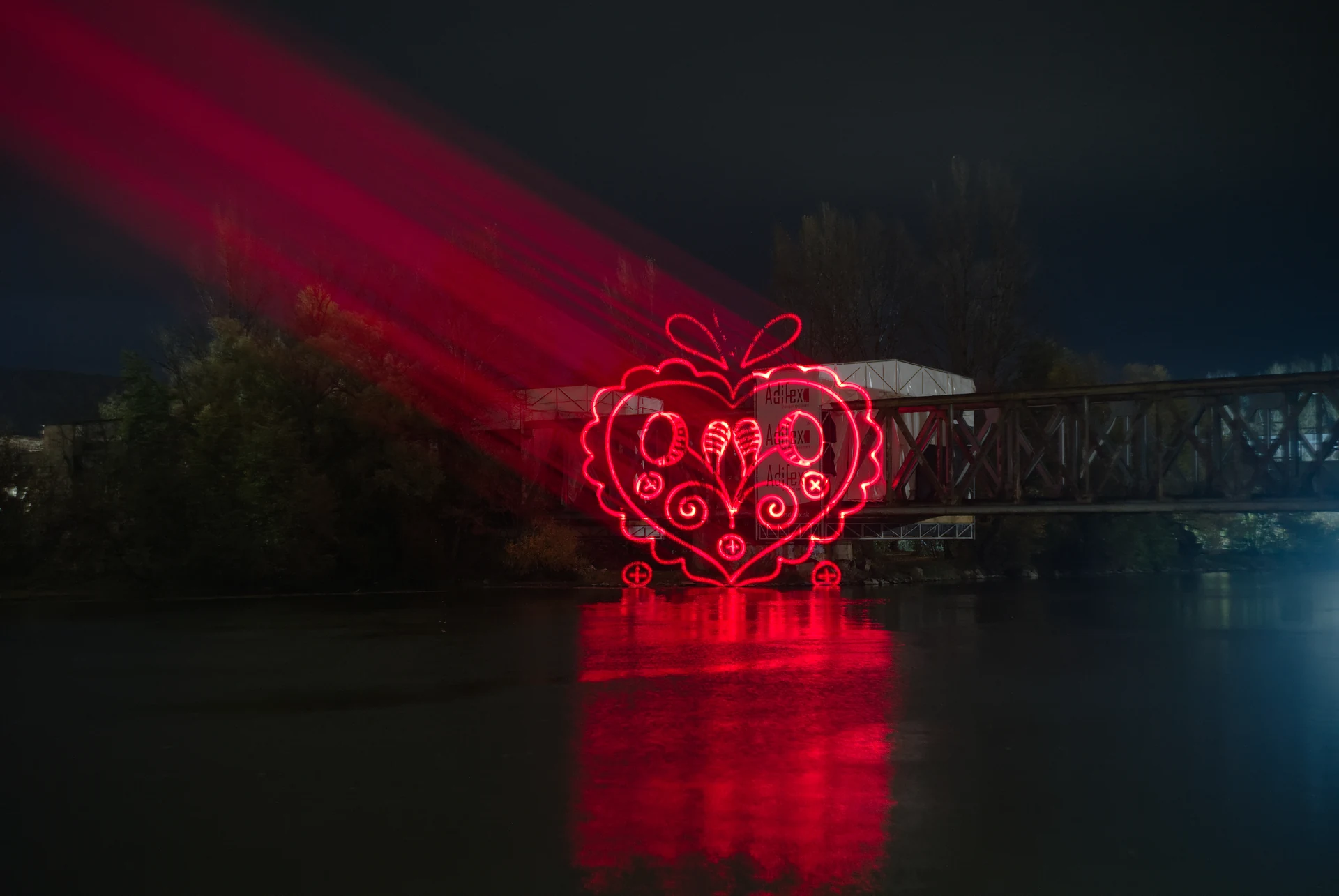 Red ornamental projection above the river